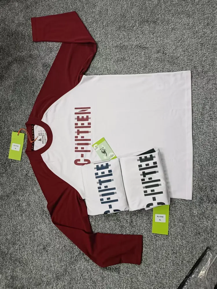 White and maroon raglan long-sleeve C-Fifteen shirt on grey carpet