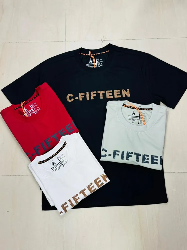Black C-Fifteen graphic t-shirt laid out with folded red, white and sage colourways