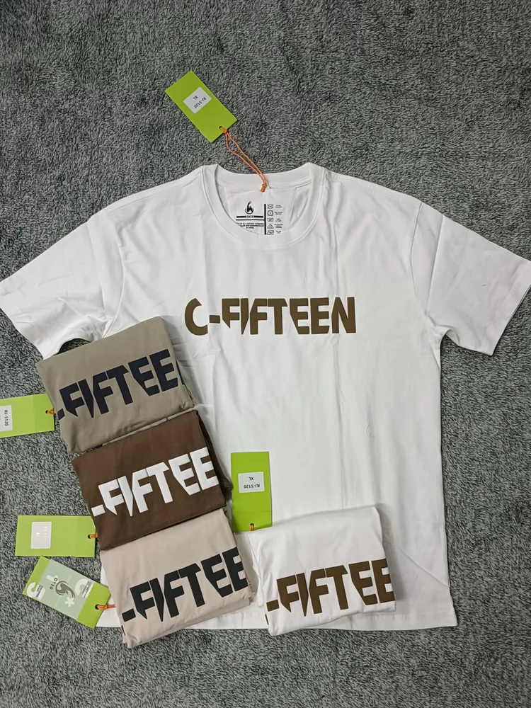 White C-Fifteen t-shirt with tan and brown folded colourways on grey carpet